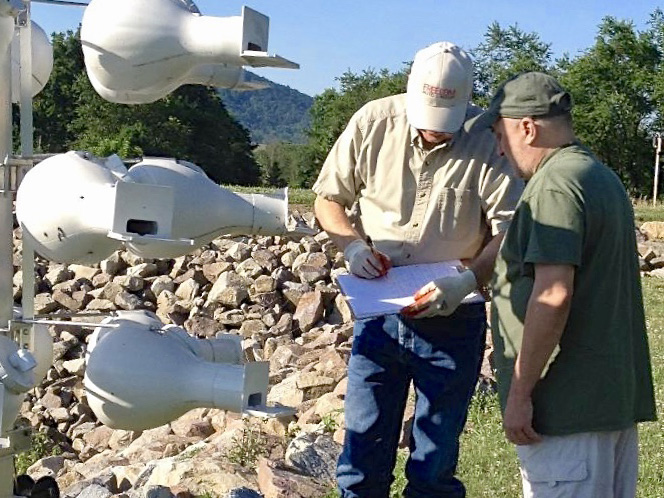 two monitors checking plastic purple martin gourds